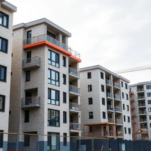 Residential buildings under construction with safety signs
